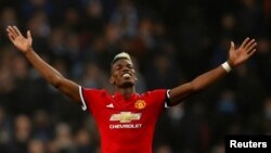 Paul Pogba de Manchester United jubile après la victoire de son équipe contre Manchester City 3-2 au Stade Etihad, Manchester, 7 avril 2018.