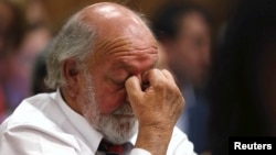 Barry Steenkamp, father of Reeva Steenkamp, reacts as he hears the verdict at the North Gauteng High Court in Pretoria, Sept. 12, 2014.