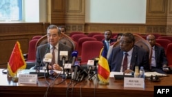 Chad's Foreign Minister Abderaman Koulamallah, right, meets with his Chinese counterpart Wang Yi at the Ministry of Foreign Affairs in N'Djamena on Jan. 8, 2025.