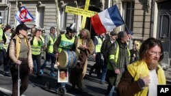 Yellow vest protesters march during a protest in Paris, France, Feb. 17, 2019.