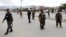 Afghan soldiers stand guard at the site of a blast in Kabul, Afghanistan, May 30, 2019.