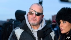 Oath Keepers founder Stewart Rhodes, who was convicted on charges relating to the Jan. 6, 2021, riot at the U.S. Capitol, talks to reporters outside the Washington Central Detention Facility after being released from jail on Jan. 21, 2025.