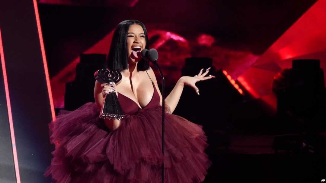 FILE - Singer Cardi B accepts the Best New Artist award during the 2018 iHeartRadio Music Awards at The Forum in Inglewood, California, March 11, 2018.