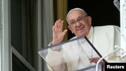 Pope Francis leads the Angelus prayer from his window at the Vatican Sept. 22, 2024. Vatican Media/­Handout via REUTERS 