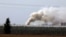 FILE - Smoke rises near the area where the Israeli forces said a significant cross-border tunnel from the Gaza Strip was destroyed, near Israel's border with the Gaza Strip, Dec. 10, 2017.