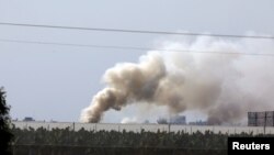 Smoke rises near the area where the Israeli forces said a significant cross-border tunnel from the Gaza Strip was destroyed, near Israel's border with the Gaza Strip, Dec. 10, 2017.