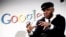 FILE - Musician Mos Def speaks on a panel discussing Google's new music search in Los Angeles, Oct. 28, 2009.