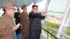 FILE PHOTO - North Korean leader Kim Jong Un inspects the construction site of the Wonsan-Kalma coastal tourist area as Kim Su Gil, 3rd from left, newly appointed director of the General Political Bureau of the Korean People's Army, looks on, in this undated photo.