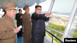 FILE PHOTO - North Korean leader Kim Jong Un inspects the construction site of the Wonsan-Kalma coastal tourist area as Kim Su Gil, 3rd from left, newly appointed director of the General Political Bureau of the Korean People's Army, looks on, in this undated photo.