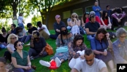 People pray at a memorial for the lives lost during centennial commemorations of the Tulsa Race Massacre, May 28, 2021, in Tulsa, Okla. 