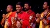 South African singing group Ladysmith Black Mambazo performs Sunday, April 10, 2005, at Town Hall in New York. Leader and founder Joseph Shabalala,center, sings in front of the others in the group.. (AP Photo/Chad Rachman)