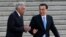 Sri Lanka's Prime Minister Ranil Wickremesinghe, (l) chats with Chinese Premier Li Keqiang during a welcome ceremony outside the Great Hall of the People in Beijing, April 7, 2016.