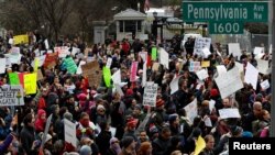 Activists gather outside the White House to protest President Donald Trump's executive actions on immigration in Washington, Jan. 29, 2017.