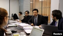 FILE - Chilean prosecutor Emiliano Arias, who is leading an investigation into alleged sex abuse crimes by Roman Catholic priests, is seen at his workplace in Rancagua, Chile, July 18, 2018.