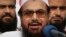 FILE - Hafiz Saeed, founder and leader of Lashkar-e-Tayyiba, a U.S.-designated global terror group, addresses an anti-Indian rally in Lahore, Pakistan, on Oct. 26, 2018. India announced on Dec. 29, 2023, that it has asked Pakistan to extradite Saeed in a "money laundering case."