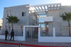 Security personnel stand guard outside the provisional consulate of the U.S. in Dakhla, Morocco-administered Western Sahara, Jan. 10, 2021.