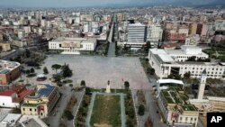 FILE - The empty Tirana's main Skanderbeg Square, is seen for above, March 22, 2020. . 