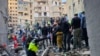 Rescuers search for victims at the site of an Israeli airstrike that targeted a building in Beirut, Lebanon, Nov. 26, 2024. 