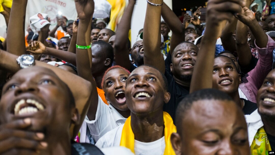 Supporters of newly re-elected Congo President Denis Sassou Nguesso celebrate his victory in Brazzaville on March 24, 2016 after the Independent Electoral Commission declared him the winner.