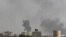 Smoke billows from the site of Saudi-led airstrikes on al-Dailami air base in Yemen's capital, Sana'a, Sept. 6, 2015. 