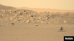 This file photo, captured by NASA's Perseverance rover, shows the Ingenuity helicopter on the surface of Mars. The image was received on June 15, 2021. (Credit: NASA/JPL-Caltech/ASU)