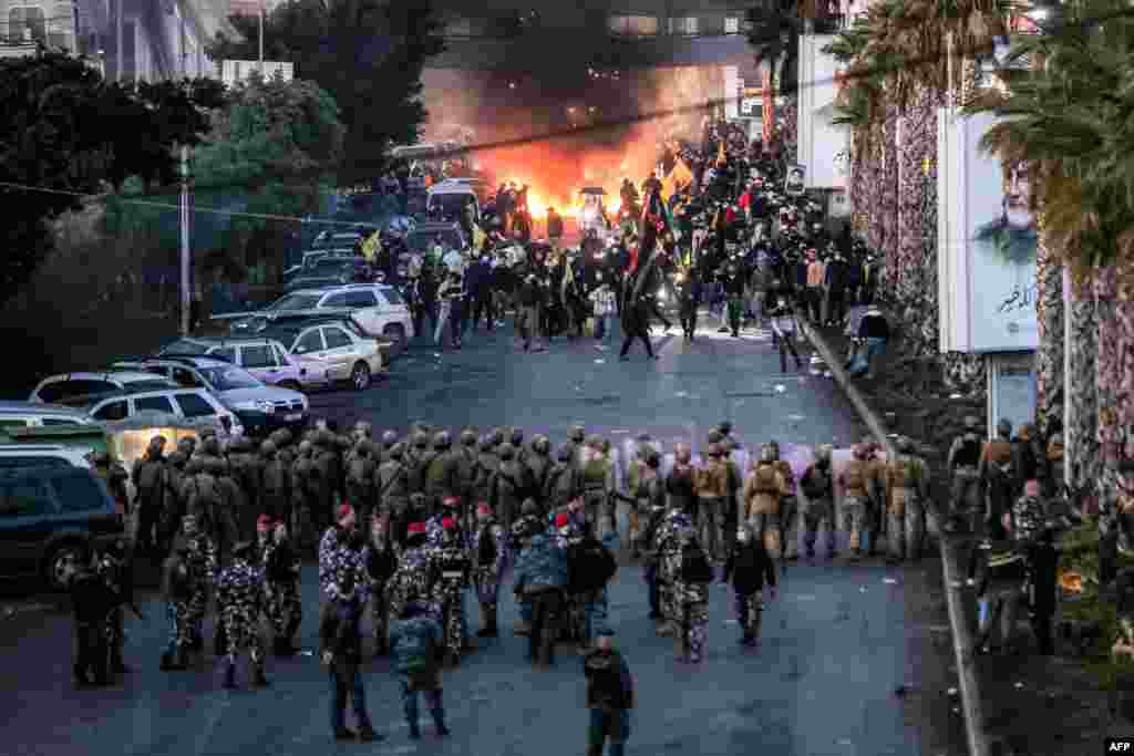 Lebanese Shiite Islamist movement Hezbollah blocks the road to Beirut International Airport during a protest against a decision to bar two Iranian flights from landing there, in Beirut, Feb. 15, 2025.