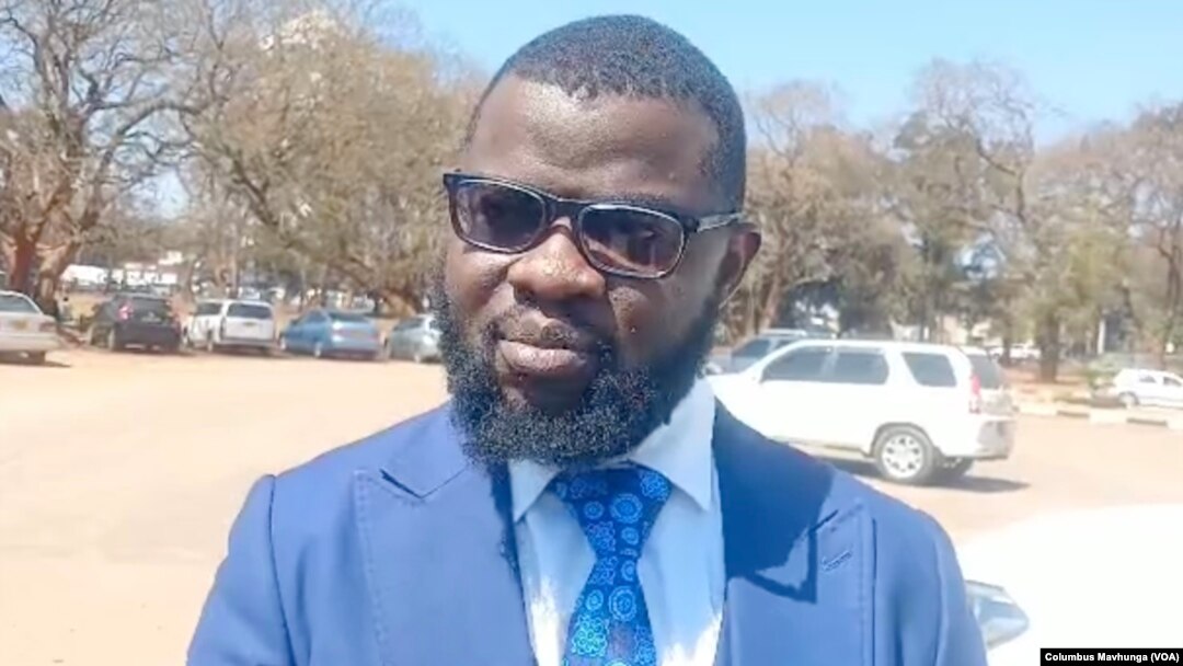 Jeremiah Bamu, of Zimbabwe Lawyers for Human Rights, speaks outside the Harare Magistrates Court, on Sept. 4, 2024.