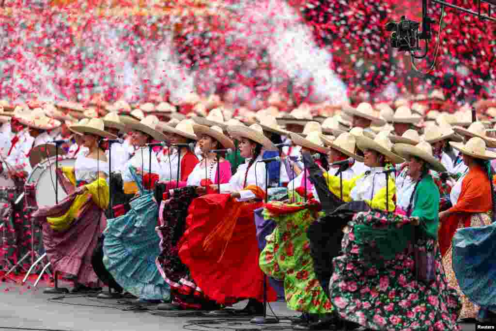 Participants in historical costumes attend the celebrations to mark the 114th anniversary of the Mexican Revolution, in Mexico City, Mexico, Nov. 20, 2024. 