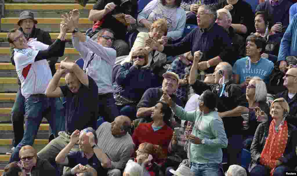 Spectators react as a ball lands in the stand hit for 6 runs by Australia&#39;s George Bailey during the fourth one-day international against England at Sophia gardens in Cardiff, Wales, UK.&nbsp;