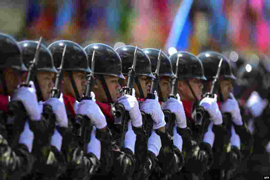 Thai army honor guards march during the handover ceremony for new chief General Chalermchai Sitthisart at the army headquarters in Bangkok. Sittisart was appointed after General Thirachai Nakwanich retired this month.