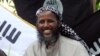 FILE - Mukhtar Robow, then a leader of the Somali militant group al-Shabab, is seen at a news conference at a farm in southern Mogadishu's Afgoye district in Somalia, May 11, 2011. 