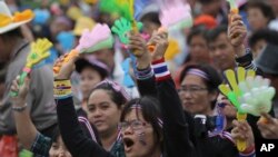 Anti-government protesters shout on the stage during a rally against a political amnesty bill at the democracy monument in Bangkok, Thailand, Nov. 8, 2013.