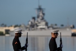 U.S. Marines stand in front of the USS Missouri during a ceremony to mark the 78th anniversary of the Japanese attack on Pearl Harbor, Dec. 7, 2019, at Pearl Harbor, Hawaii.