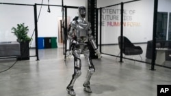 Humanoid robot Figure 01 is demonstrated at Figure AI's test facility in Sunnyvale, Calif., Tuesday, Oct. 3, 2023. 