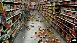  Food that fell from the shelves litters the floor of an aisle at a Walmart following an earthquake in Yucca Yalley, Calif., 155 miles from Ridgecrest, where a magnitude 7.1 quake struck, July 5, 2019.