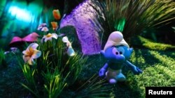 A Smurf characters is seen at the Smurf Experience exhibition, depicting a larger-than-life recreation of the Smurf village, marking the 60th anniversary of the creation of the Smurfs by cartoonist Peyo, in Brussels, Belgium, June 12, 2018. 