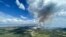 This July 27, 2023, aerial image from the British Columbia Wildfire Service, shows smoke from the the Ross Moore wildfire south of Kamloops, British Columbia, Canada.