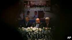 FILE - Roberto Rivas (C), President of the Supreme Electoral Council, speaks during a press conference in Managua, Nicaragua.