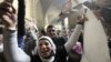 A supporter of deposed Egyptian president Hosni Mubarak celebrates and shouts slogans outside a High Court in Cairo, January 13, 2013. 