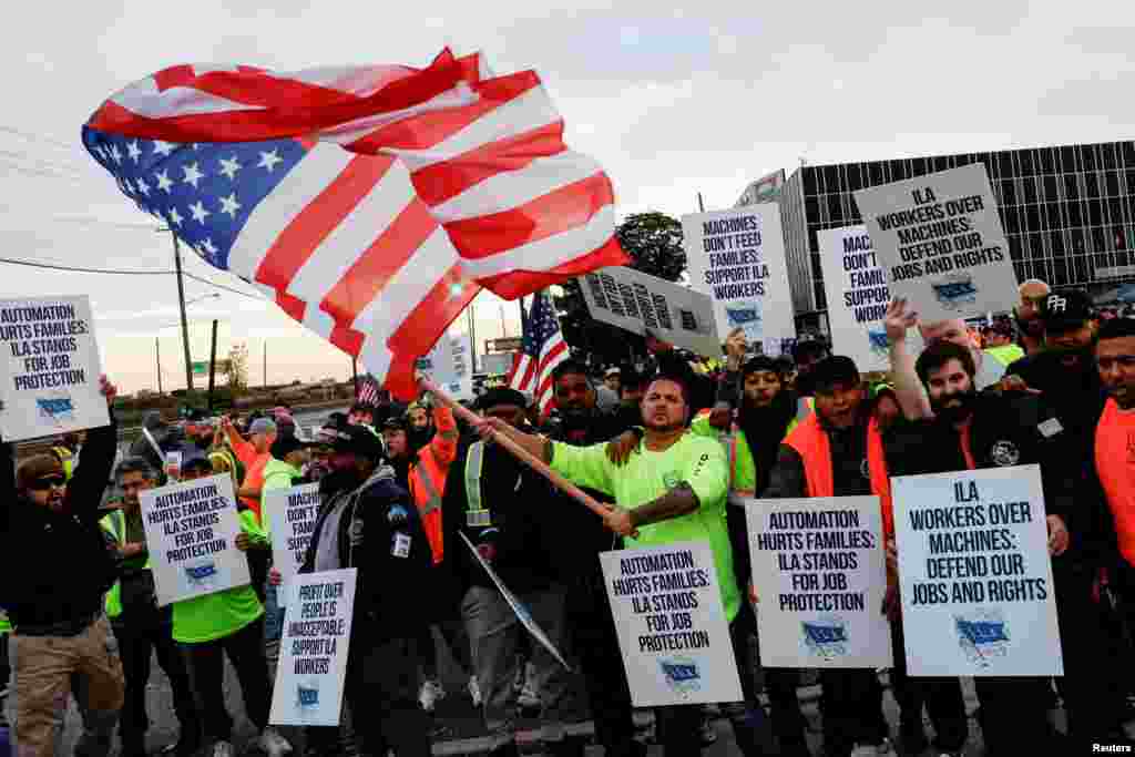 Members of the International Longshoremen&#39;s Association union, which represents about 45,000 workers, go on strike outside Maher Terminal in Elizabeth, New Jersey.&nbsp;U.S. East Coast and Gulf Coast dockworkers began a strike, their first large-scale stoppage in nearly 50 years, halting the flow of about half the nation&#39;s ocean shipping after negotiations for a new labor contract broke down over earnings.