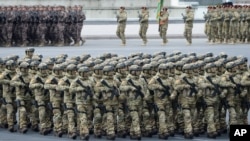 Azerbaijani troops march past during a parade in Baku, Azerbaijan, Dec. 10, 2020. 