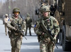 British soldiers with the NATO-led Resolute Support Mission arrive at the site of an attack in Kabul, Afghanistan, March 6, 2020.