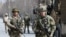 FILE - British soldiers with NATO-led Resolute Support Mission arrive at the site of an attack in Kabul, Afghanistan, March 6, 2020. 
