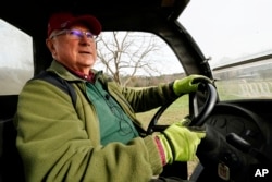 Trailer park owner Ed Smith drives a four-wheeler at Stearns Park, Wednesday, Nov. 15, 2023, in Hinsdale, N.H. Smith is one of the trustees in charge of a $3.8 million gift to the town from his friend Geoffrey Holt. (AP Photo/Robert F. Bukaty)