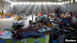 FILE - Displaced people are seen at the Shire campus of Aksum University, which was turned into a temporary shelter for people displaced by conflict, in the town of Shire, Tigray region, Ethiopia, March 14, 2021.