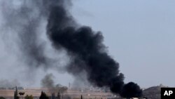 In this photo taken from the Turkish side of the border between Turkey and Syria, in Akcakale, Sanliurfa province, southeastern Turkey, smoke billows from targets inside Syria during bombardment by Turkish forces, Oct. 10, 2019. 