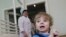 Adoption candidate Mark, 2, reacts in the children's department of a local hospital in Russia's Siberian city of Krasnoyarsk March 23, 2011.