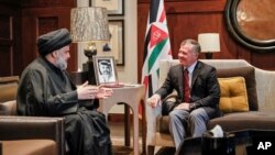 Influential Iraqi Shi'ite cleric, Muqtada al-Sadr, meets with Jordan’s King Abdullah II at the royal palace in Amman, Jordan, Oct. 23, 2017. 