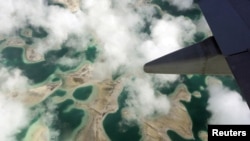 FILE - An aerial view shows Kiritimati Island, part of the Pacific island nation of Kiribati, April 5, 2016. China's plans to study the feasibility of upgrading a World War II-era airstrip on the Kiribati island of Kanton have been met with anxiety.