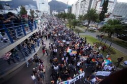 Revelers attend the gay pride parade in Quito, Ecuador, June 29, 2019.